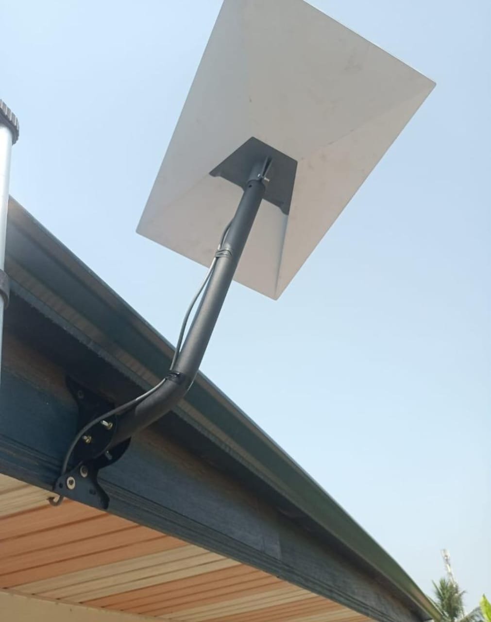 A Starlink satellite dish installed by Truthsol Limited, mounted under a roof eave